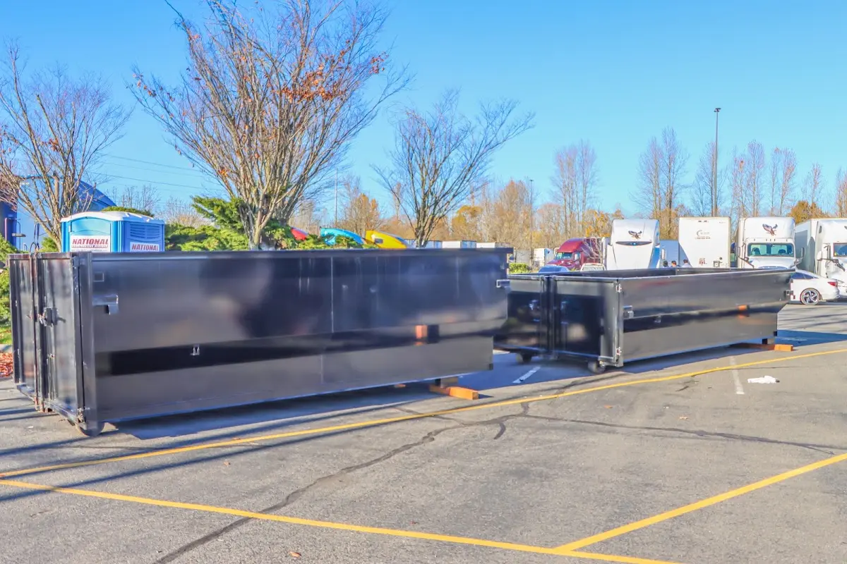 Professional dumpster rental service with roll-off container on residential driveway in South Daytona